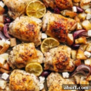 Hellenic Citrus Herb Chicken 5 Greek Chicken And Potatoes on a baking tray, beautifully golden and ready to serve