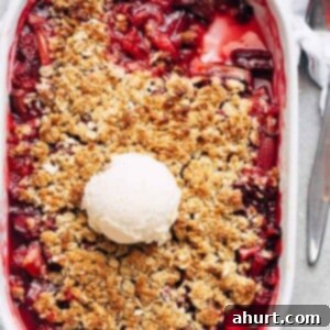 Comforting Strawberry Rhubarb Crisp 11 Strawberry Rhubarb Crisp with ice cream scoop