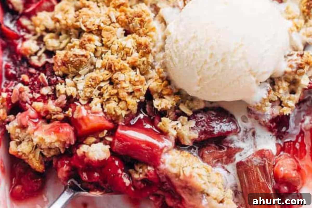 Comforting Strawberry Rhubarb Crisp 9 Close-up shot of a perfectly baked Strawberry Rhubarb Crisp (Crumble).