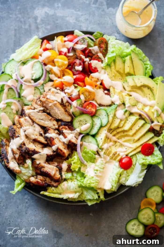 Grilled Cajun Chicken Salad with Creamy Cajun Dressing on a platter, ready to serve