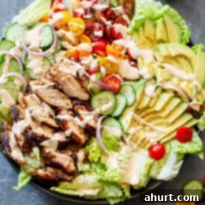 Zesty Cajun Grilled Chicken Salad with Signature Creamy Dressing 8 Grilled Cajun Chicken Salad with Creamy Cajun Dressing on a platter