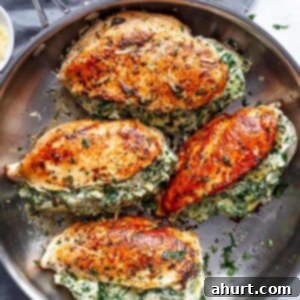 Cheesy Spinach Artichoke Stuffed Chicken 13 Spinach Artichoke Stuffed Chicken Breast on a pan, close up view