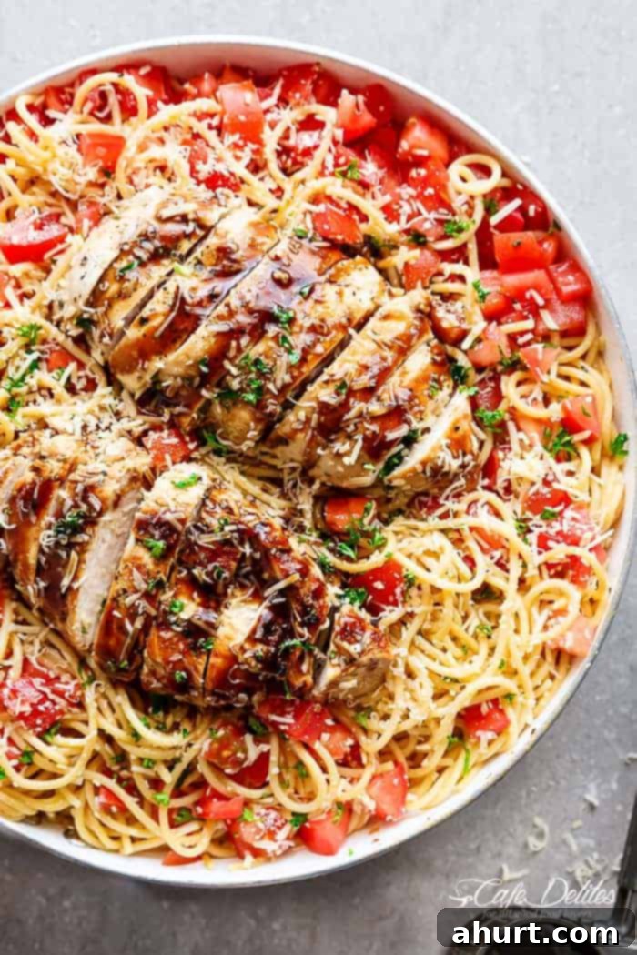 Summer Bruschetta Chicken Pasta Salad 2 Bruschetta Chicken Pasta Salad is Filled with Italian seasoned grilled chicken, garlic and parmesan cheese!