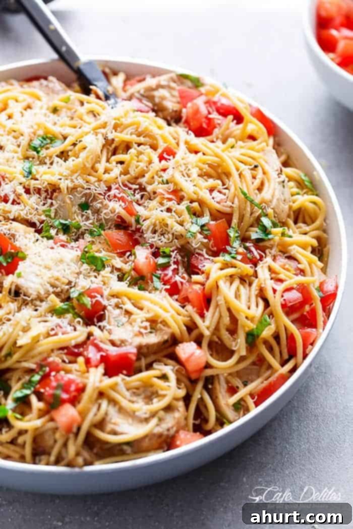 Summer Bruschetta Chicken Pasta Salad 6 Side view image of Bruschetta Chicken Pasta Salad is Filled with Italian seasoned grilled chicken, garlic and parmesan cheese!