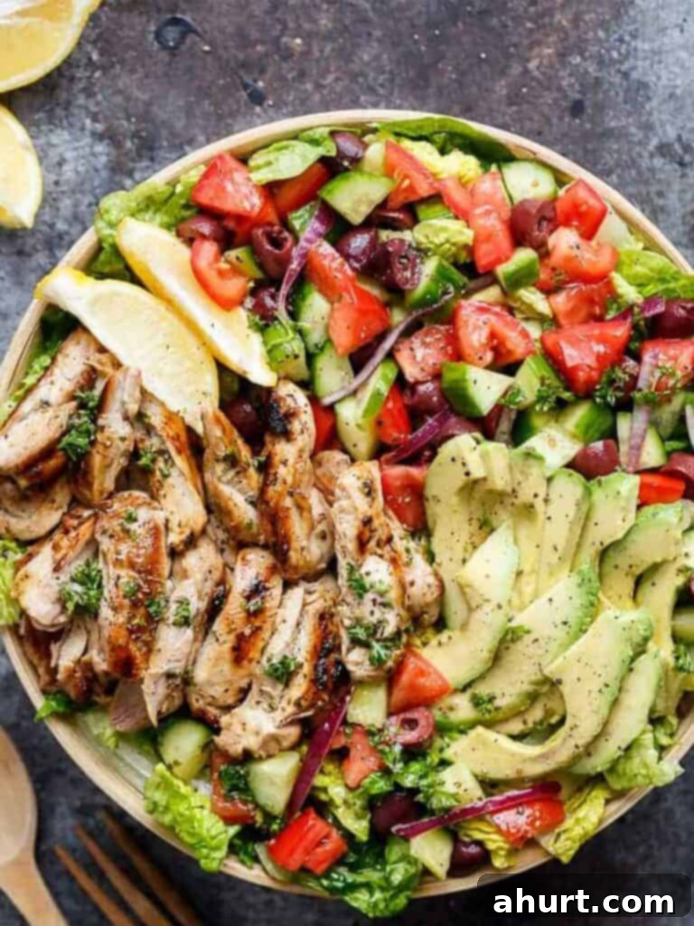 Mediterranean Grilled Lemon Herb Chicken Salad 2 Close-up of a beautifully plated Grilled Lemon Herb Mediterranean Chicken Salad with fresh vegetables and sliced chicken
