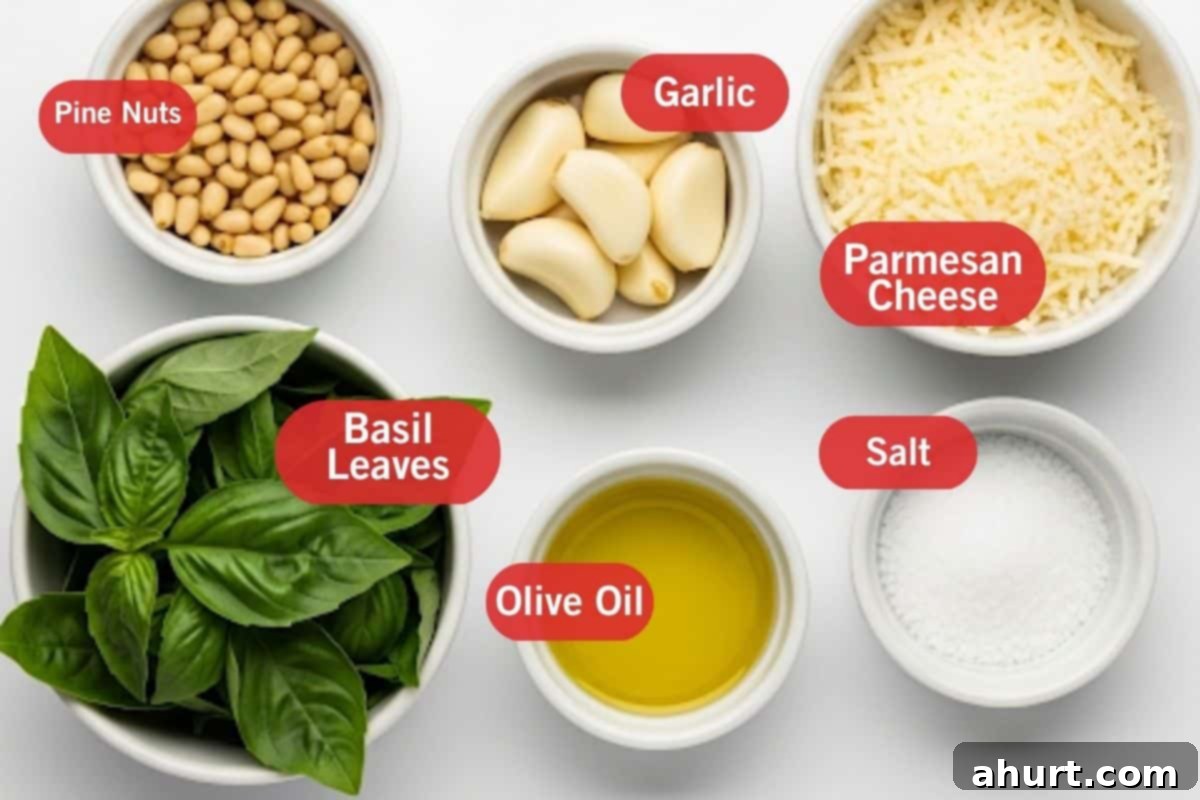 Freshly Made Basil Pesto Perfection 3 Flat lay photo of fresh basil leaves, golden pine nuts, peeled garlic cloves, a wedge of parmesan cheese, and a bottle of olive oil – all the ingredients for homemade basil pesto.