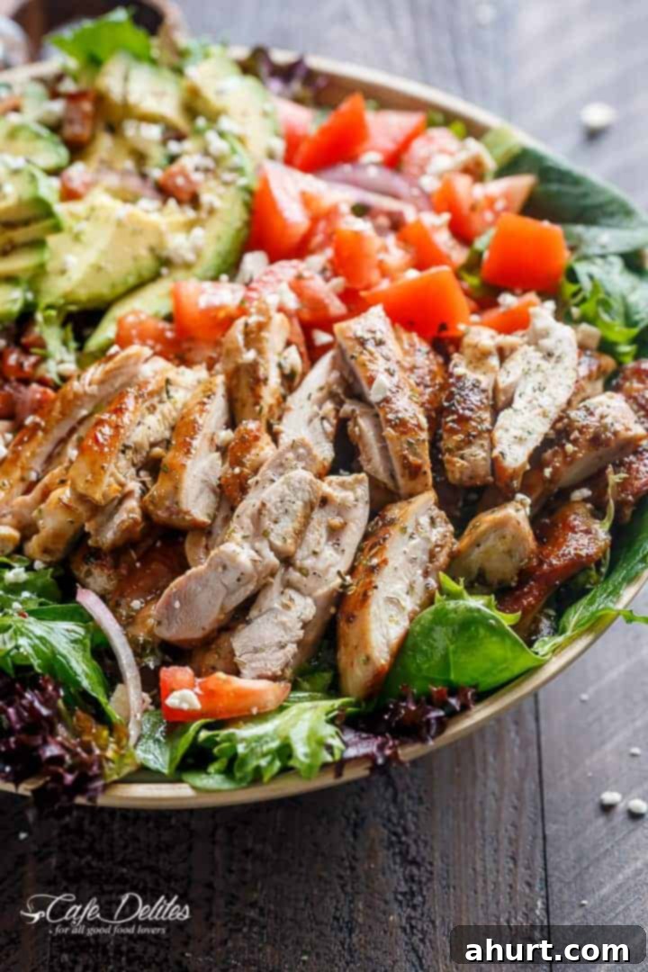 BLT Salad with Balsamic Chicken, Avocado & Feta 6 Side view of a large bowl of BLT Balsamic Chicken Avocado Feta Salad, showcasing layers of ingredients