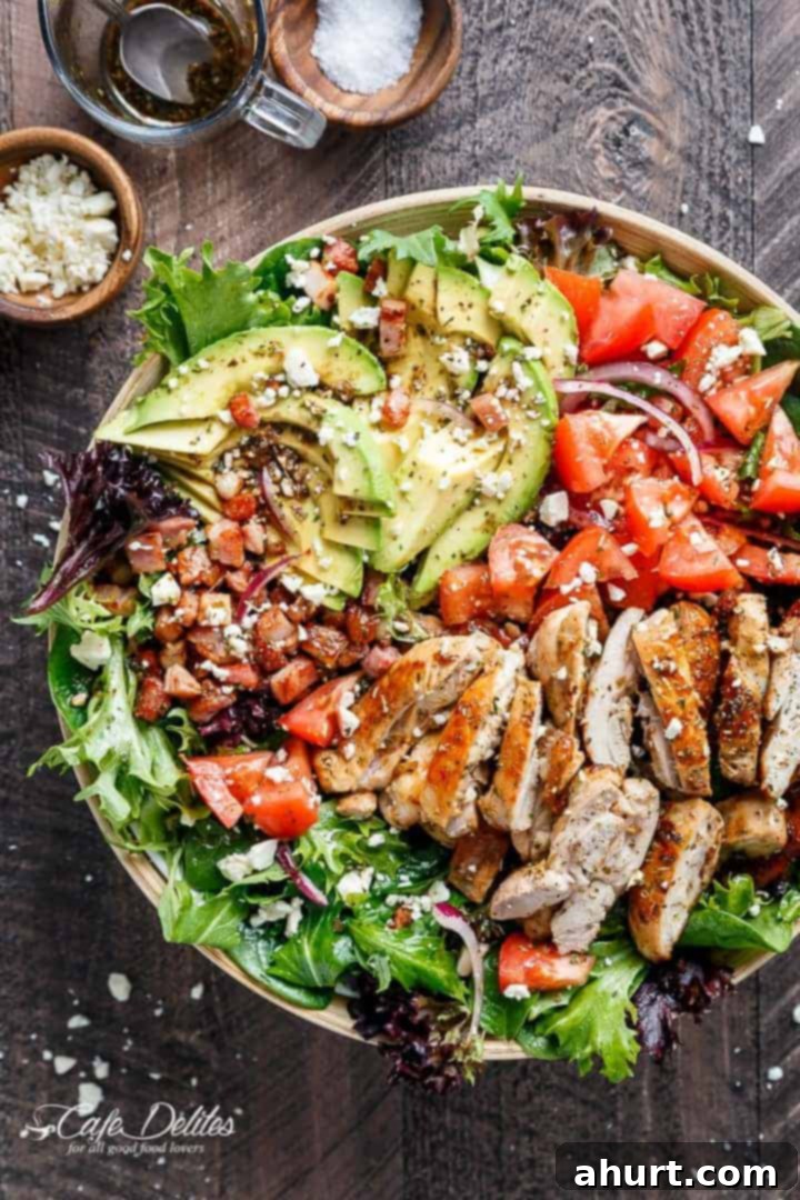 BLT Salad with Balsamic Chicken, Avocado & Feta 9 Top view of BLT Balsamic Chicken Avocado Feta Salad served on a golden tray with a fork