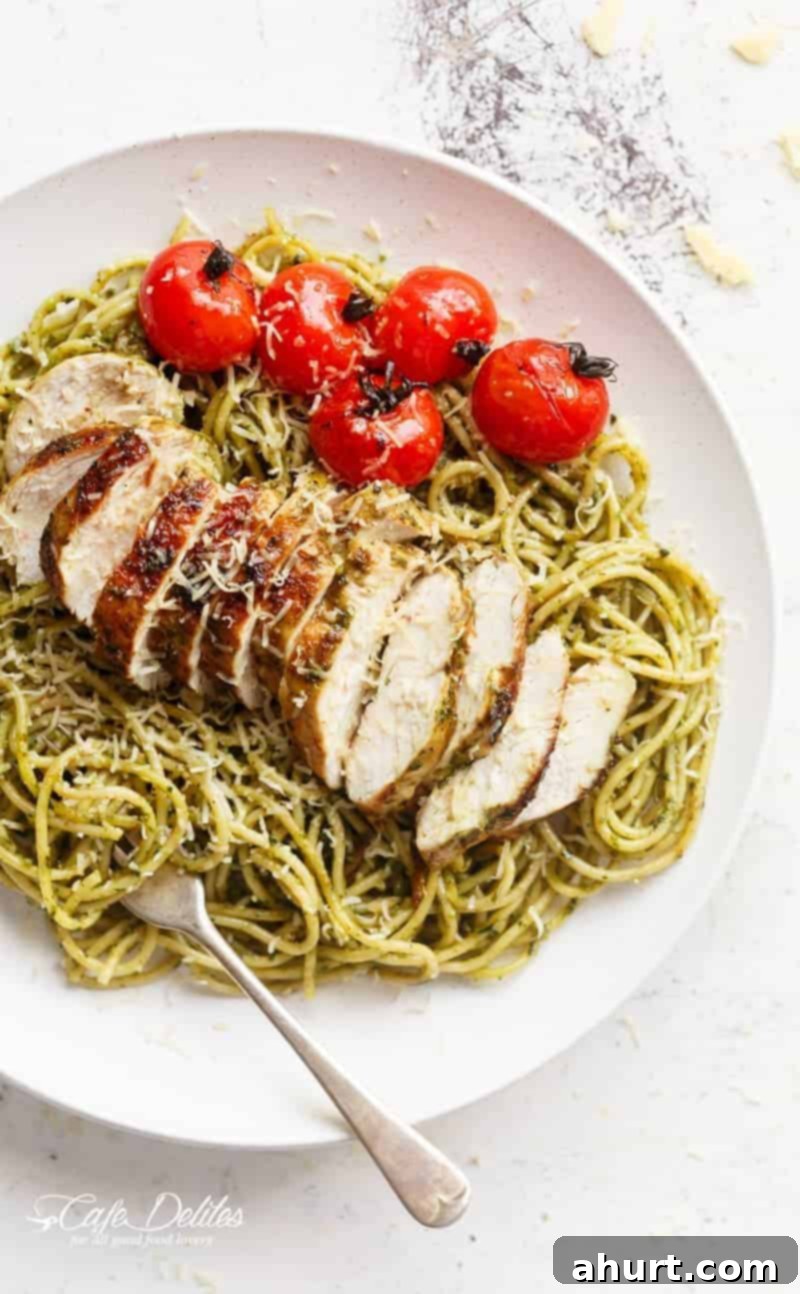 Vibrant Pesto Chicken Spaghetti 2 Basil Pesto Chicken Spaghetti on a plate with fresh basil garnish