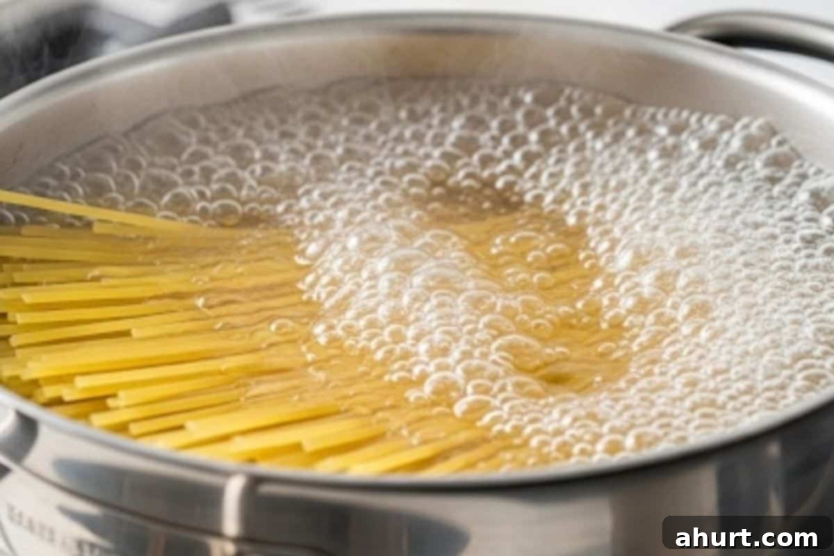 Vibrant Pesto Chicken Spaghetti 4 Cook the spaghetti in a large pot of boiling, salted water until al dente.