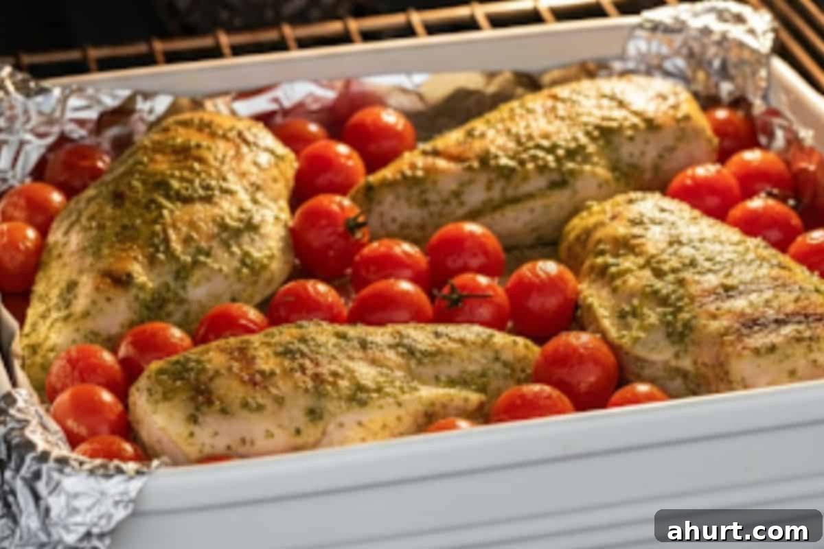 Vibrant Pesto Chicken Spaghetti 7 Place the chicken in a baking dish with foil and bake for 30 minutes. Then add the cherry tomatoes and bake another 20 minutes for oven option.