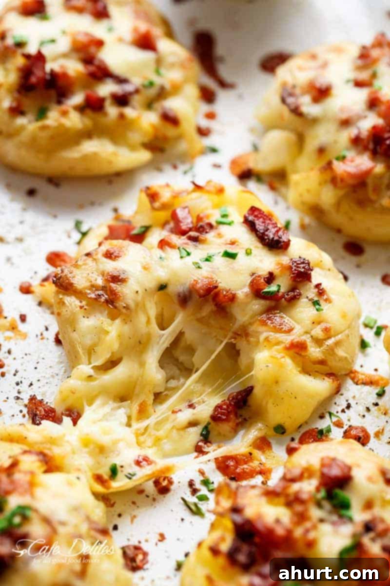 image focusing on cheesy part of Bacon Smashed Potatoes 