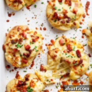 Crispy Smashed Potatoes with Bacon and Cheese 9 Cheesy Bacon Smashed Potatoes on a baking tray