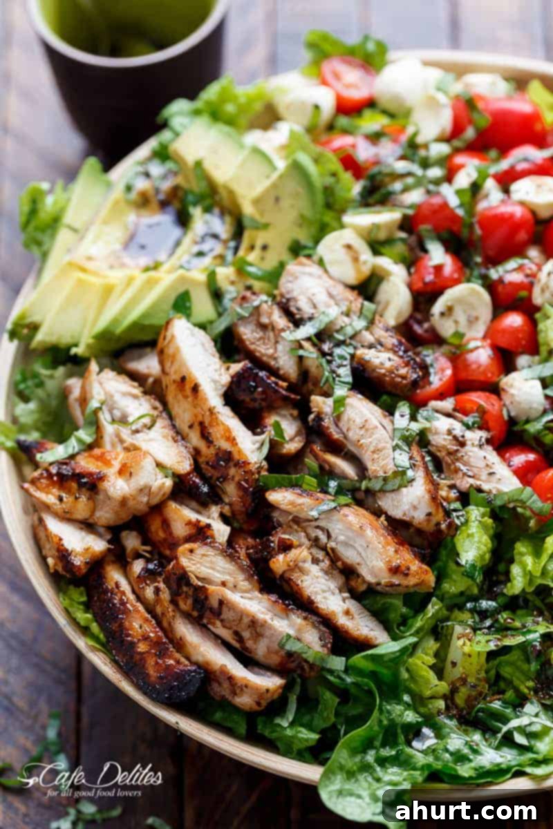 A beautifully plated Balsamic Chicken Avocado Caprese Salad ready to serve