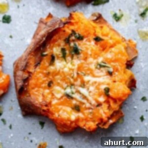 Golden Garlic Parmesan Smashed Sweet Potatoes 4 A piece of Garlic Butter Smashed Sweet Potatoes With Parmesan Cheese.
