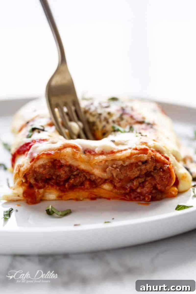 Fork poked into Lasagna Stuffed Burritos 
