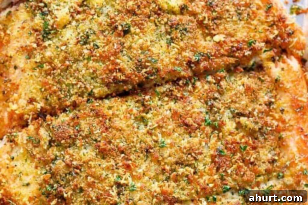 Crispy Parmesan Salmon 6 Crumb mixture being pressed onto the salmon fillet.