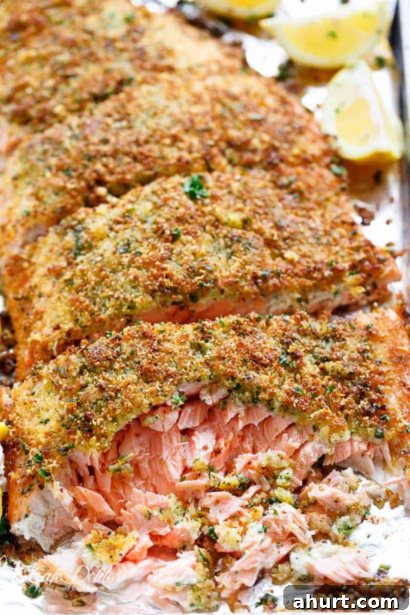Crispy Parmesan Salmon 8 Tender fall apart oven baked salmon with a crispy parmesan crumb topping on a baking tray
