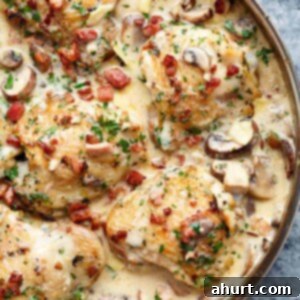 Luscious Creamy Garlic Parmesan Chicken 12 Creamy Baked Chicken Thighs with Mushrooms & Bacon in a platter