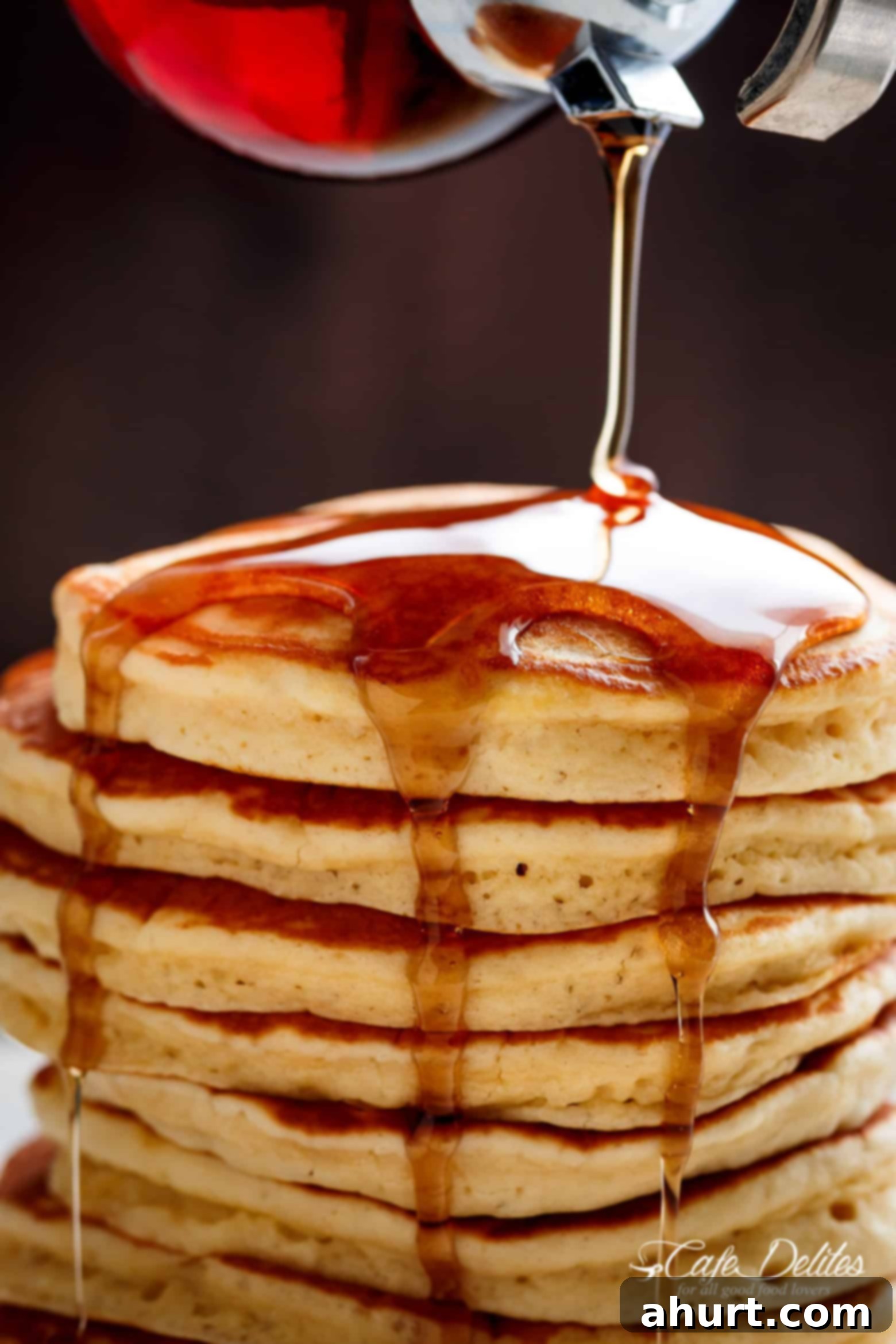 Irresistibly Fluffy Pancakes 2 Maple Syrup pouring over Fluffy Pancakes, creating a delicious breakfast scene. Weekends will never be the same again!