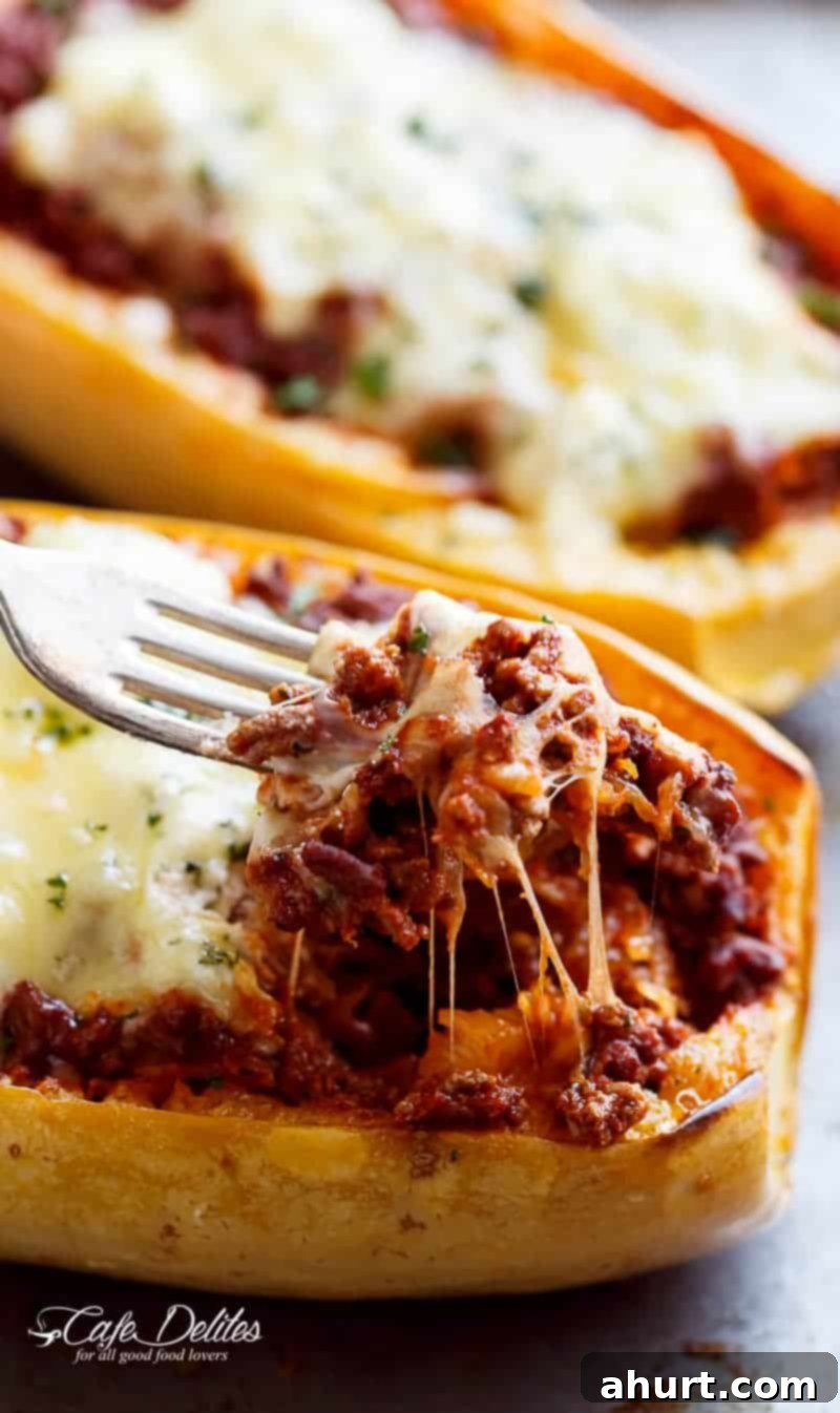 Lasagna-Stuffed Spaghetti Squash Boats 3 A bite taken from Spaghetti Squash Lasagna Boats