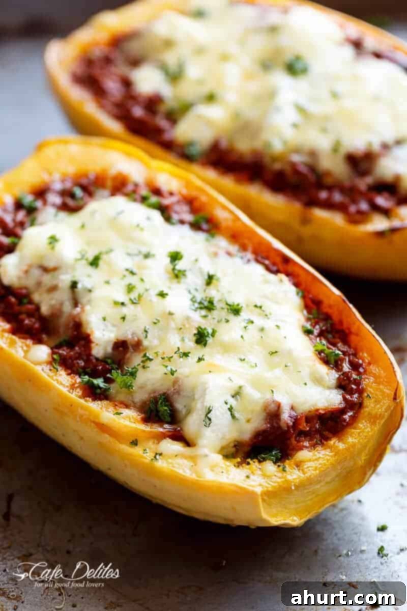 Lasagna-Stuffed Spaghetti Squash Boats 5 Side view of Spaghetti Squash Lasagna Boats With layers of spaghetti squash, bolognese sauce, creamy ricotta and mozzarella!
