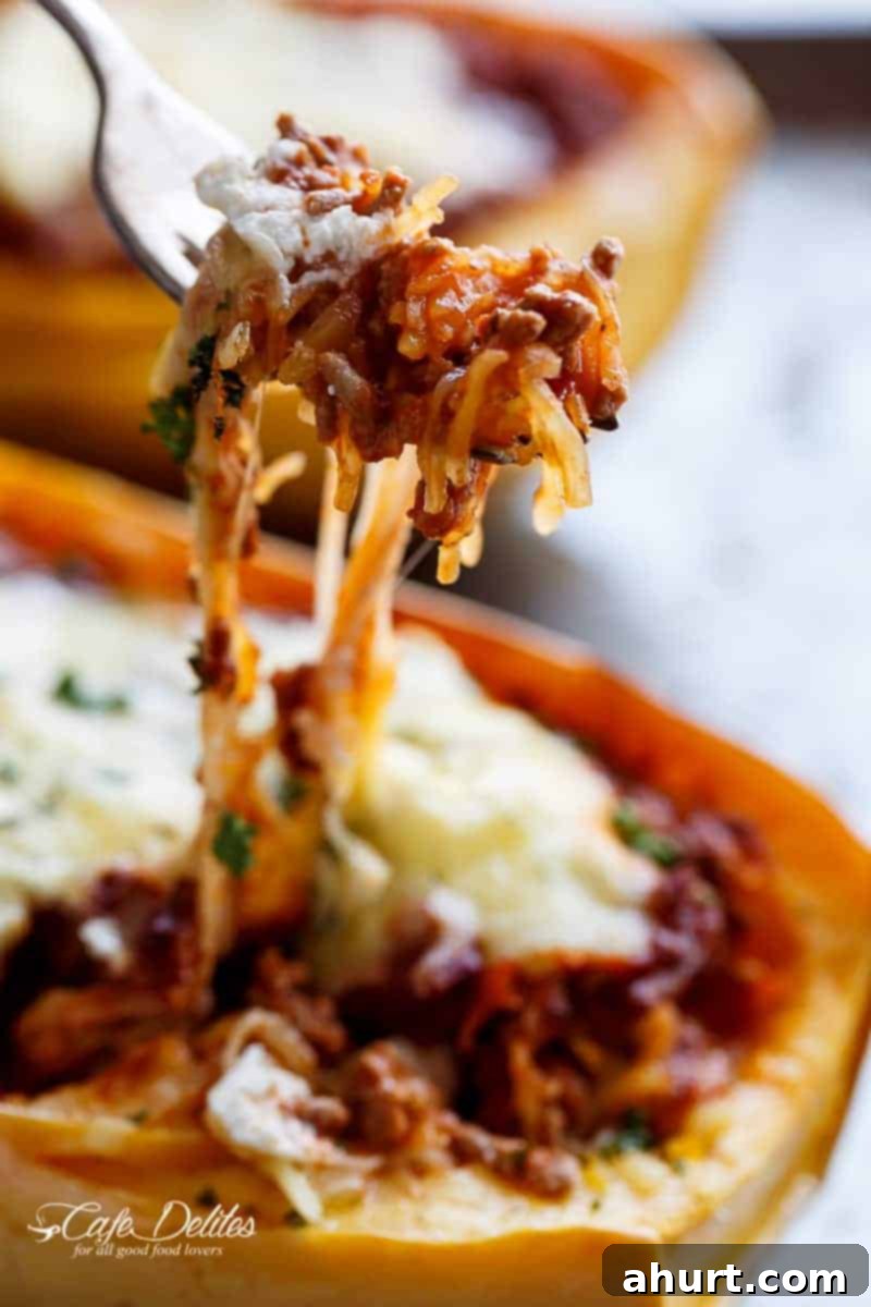 Lasagna-Stuffed Spaghetti Squash Boats 6 A bite taken from Spaghetti Squash Lasagna Boats