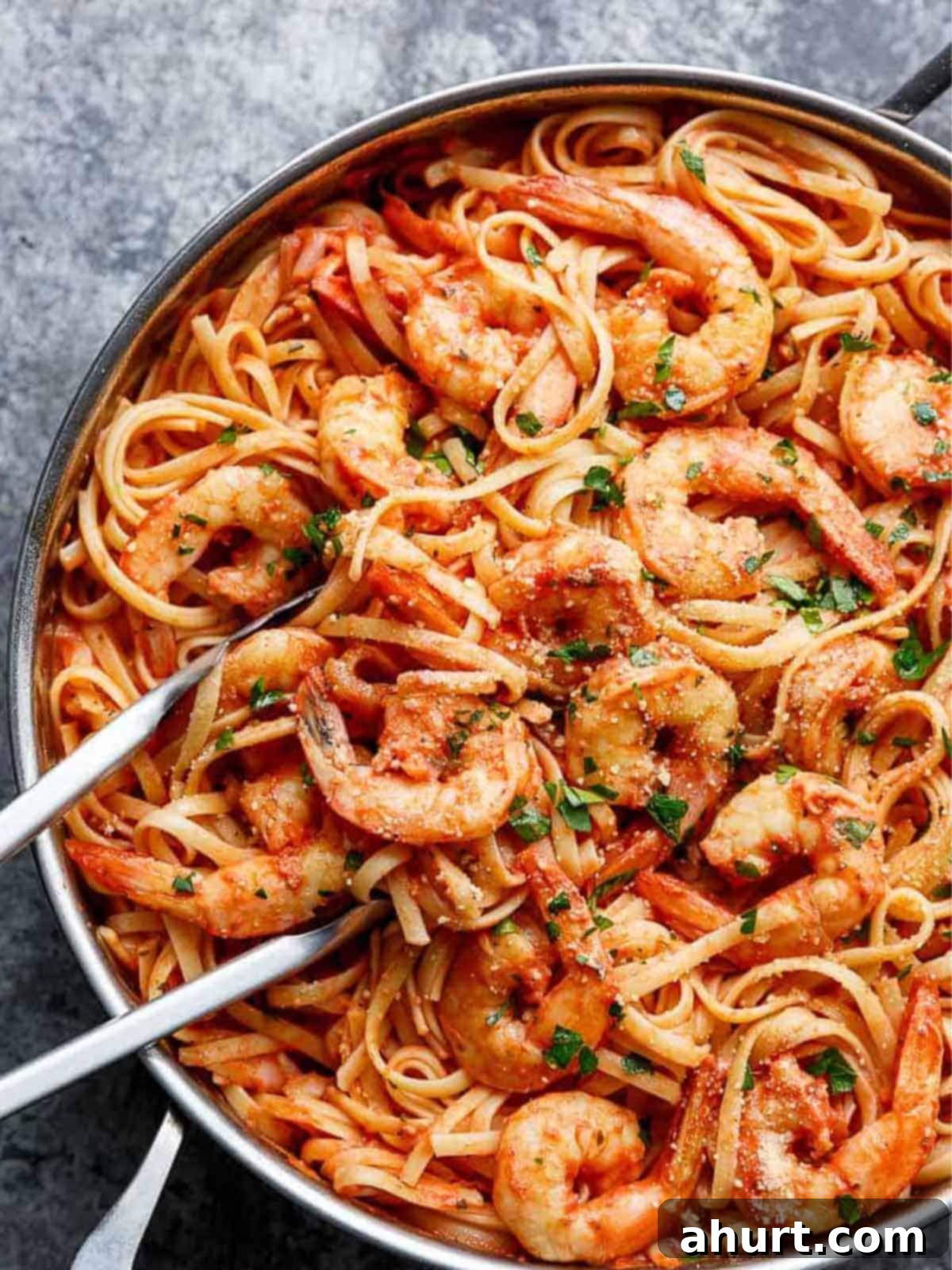 Velvety Tomato Garlic Butter Shrimp, Ready in 15 Minutes 2 Creamy Tomato Garlic Butter Shrimp in a pan, garnished with fresh herbs