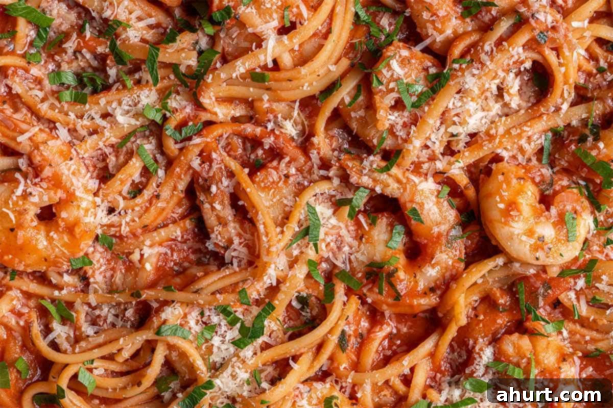 Velvety Tomato Garlic Butter Shrimp, Ready in 15 Minutes 9 Close up image of 15-Minute Creamy Tomato Garlic Butter Shrimp Pasta, ready to serve, garnished with fresh parsley