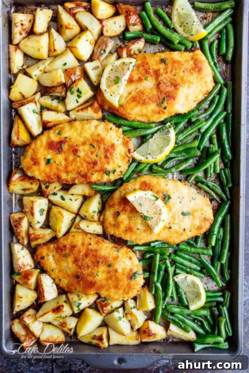 Golden Crispy Parmesan Chicken Milanese and Roasted Vegetables 2 Oven baked and CRISPY breaded Sheet Pan Lemon Parmesan Garlic Chicken & Veggies, complete with potatoes and green beans smothered in a garlic butter sauce!