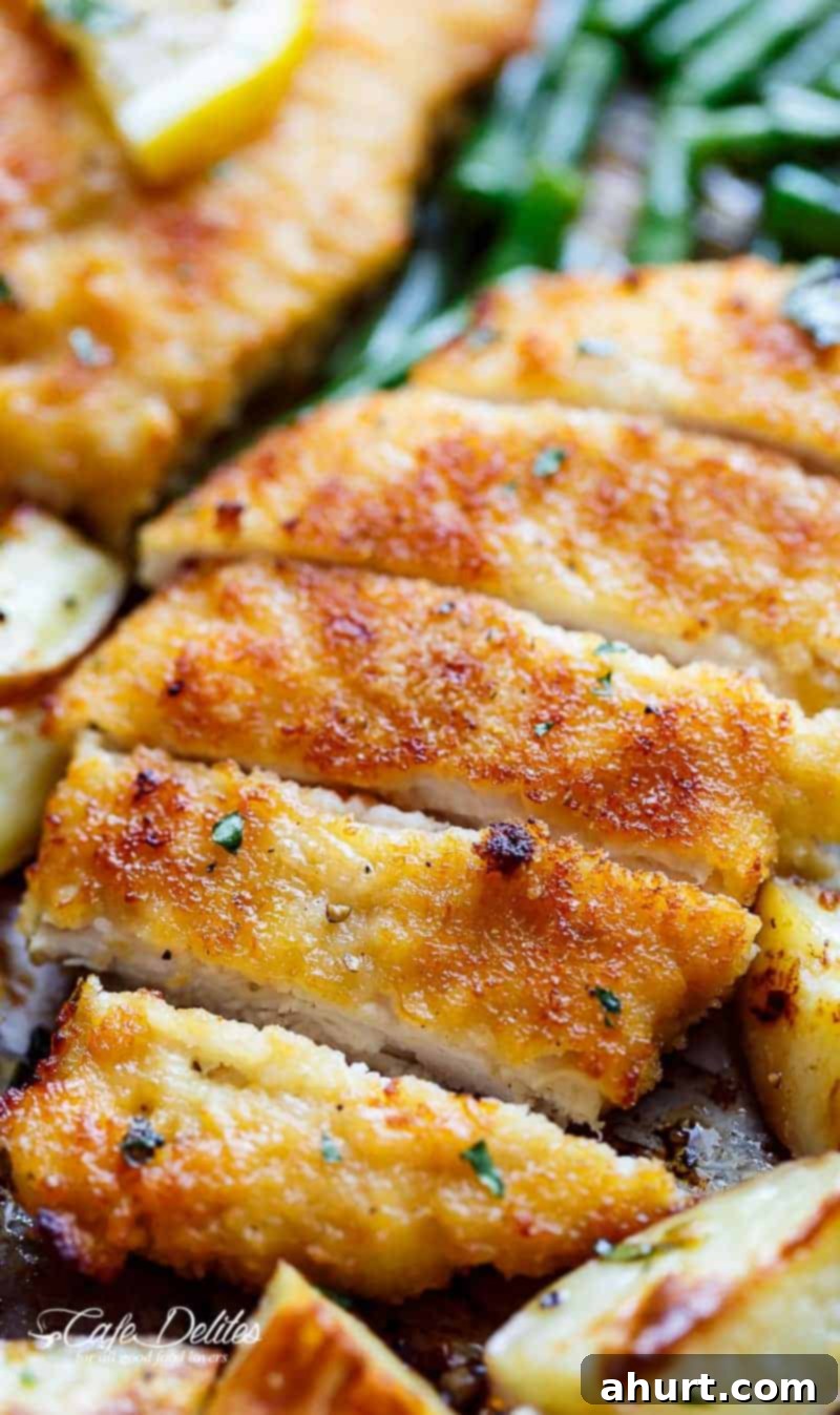 Golden Crispy Parmesan Chicken Milanese and Roasted Vegetables 3 Slices of Crispy Sheet Pan Lemon Parmesan Garlic Chicken & Veggies
