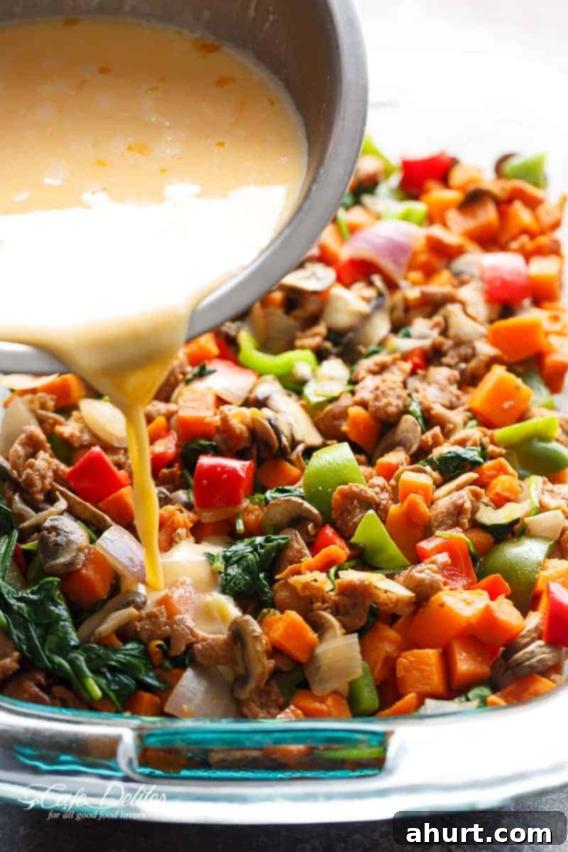 Sweet Potato Hash Brown Breakfast Bake 6 Dressing pouring on Sweet Potato Hash Brown Breakfast Casserole