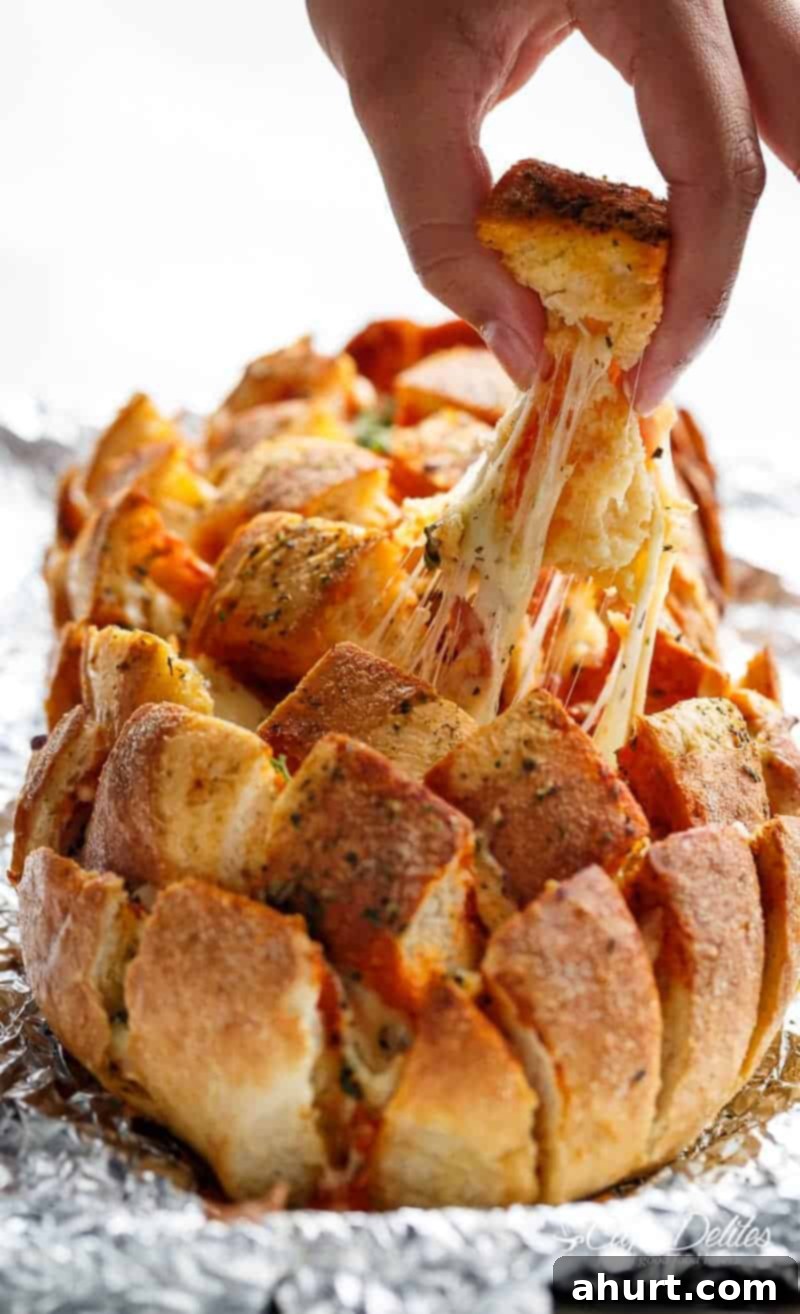 Garlic Butter Pizza Monkey Bread 2 This Garlic Butter Pizza Pull Apart Bread is smothered in garlic butter, stuffed with pizza fillings, and topped with so.much.cheese!