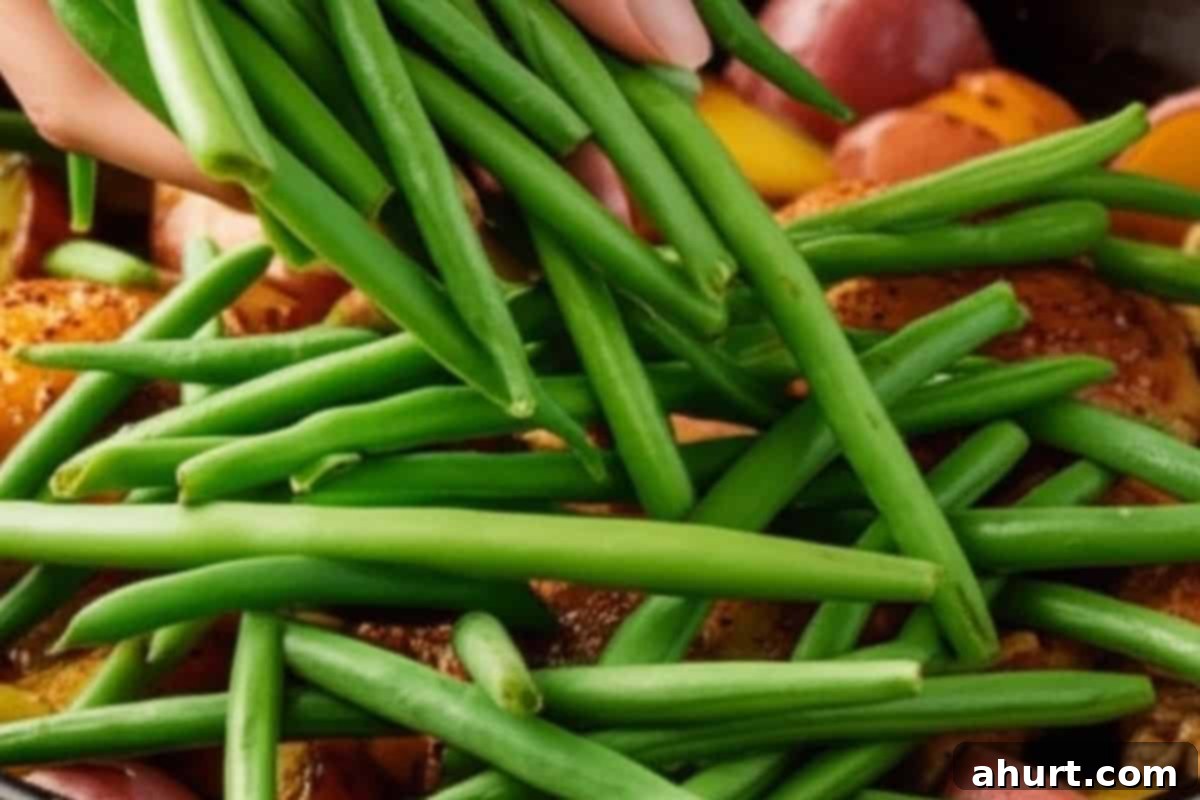 Sheet Pan Honey Mustard Chicken & Potatoes 11 add green beans and stir them into the pan after 30 minutes of baking
