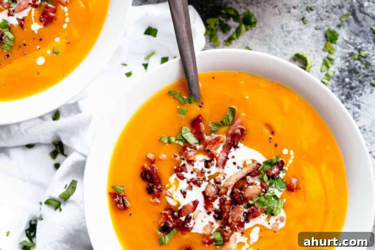 Velvety Golden Pumpkin Soup 8 Creamy Pumpkin Soup in a bowl topped with crispy bacon and fresh parsley.