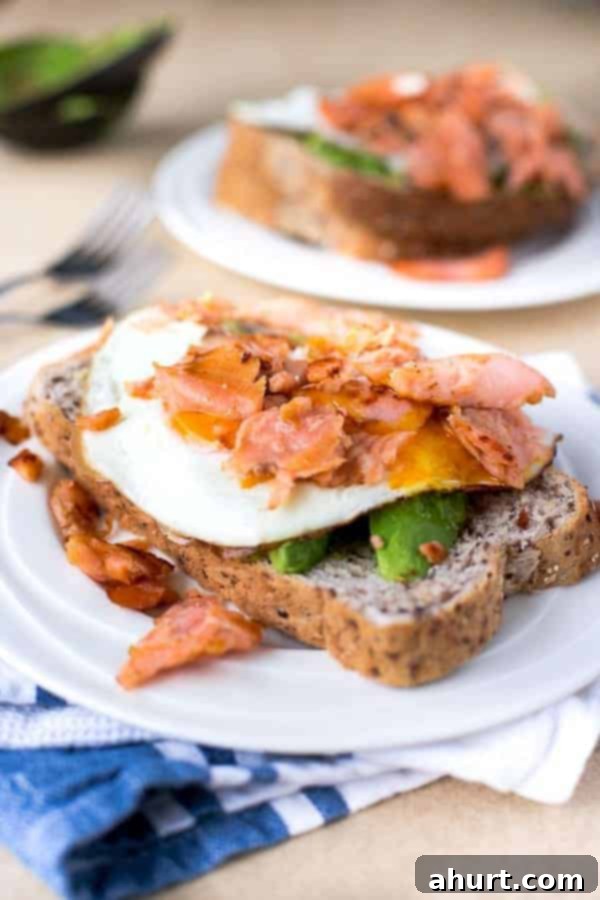 Crispy Smoked Salmon, Golden Egg Stack 4 Crispy Smoked Salmon and Poached Egg Stack on brown bread