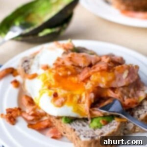 Crispy Smoked Salmon, Golden Egg Stack 6 Crispy Smoked Salmon and Fried Egg Stack on a plate