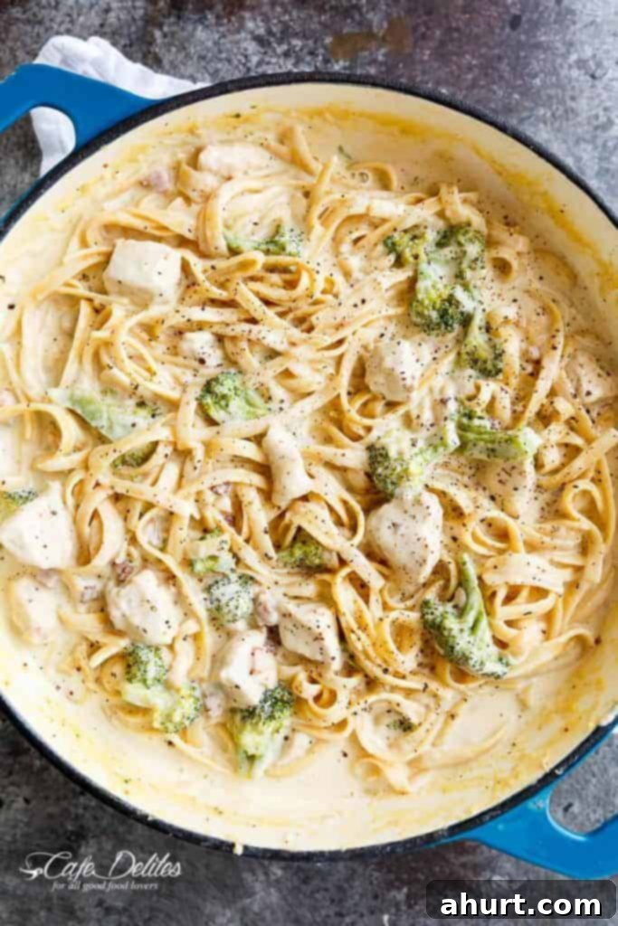 Easy One Pot Chicken Bacon Fettuccine Alfredo 2 One Pot Chicken Fettuccine Alfredo with Bacon, served in a large pot, garnished with fresh parsley.