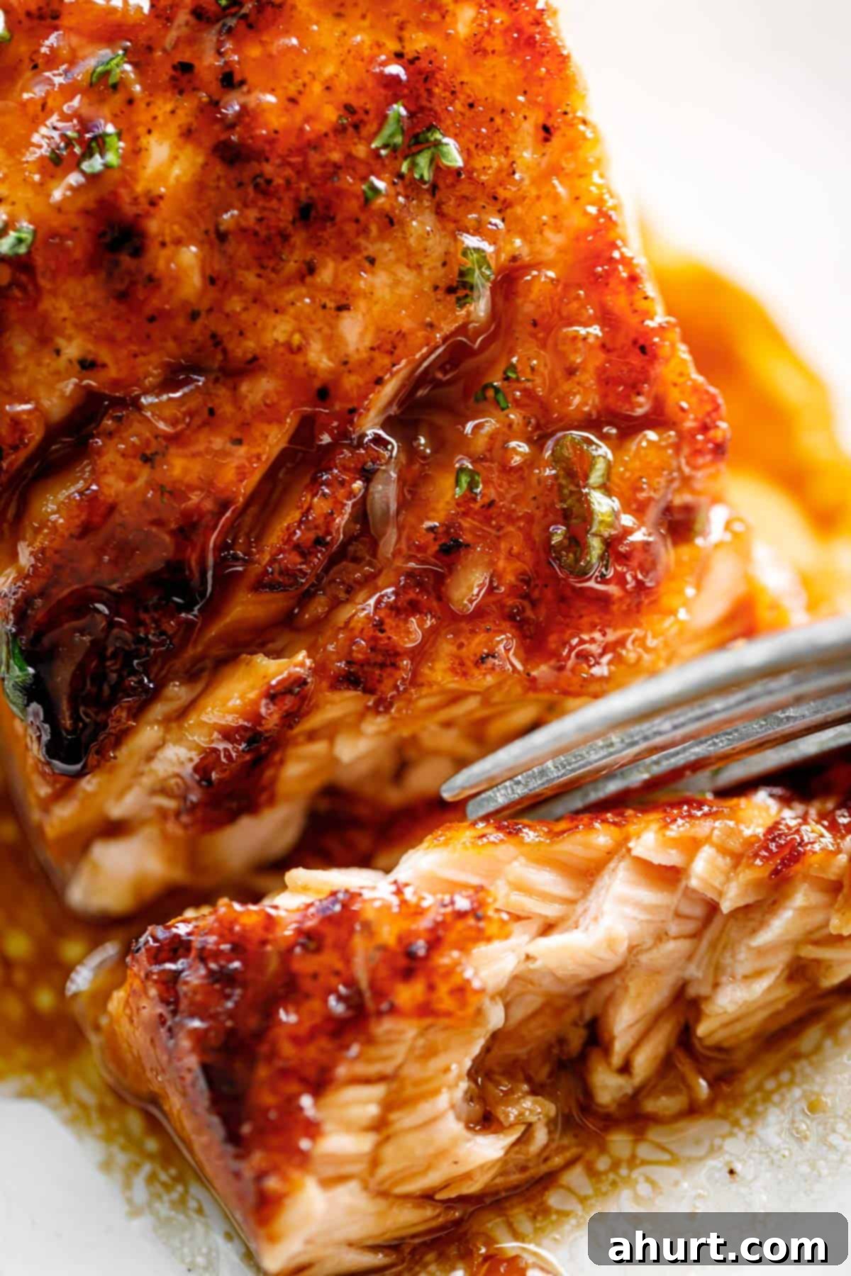 Close-up image of Crispy Honey Orange Glazed Salmon, showcasing the rich glaze and flaky texture.