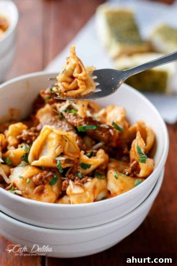 Hearty Beef Tortellini with Chunky Sauce 12 Fork holding a piece from Tortellini with Chunky Beef Sauce