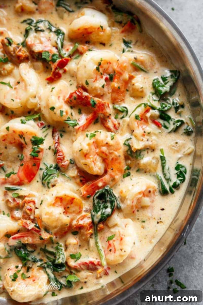 Creamy Tuscan Garlic Butter Shrimp 10 Close-up image of the finished creamy garlic Tuscan butter shrimp being served.