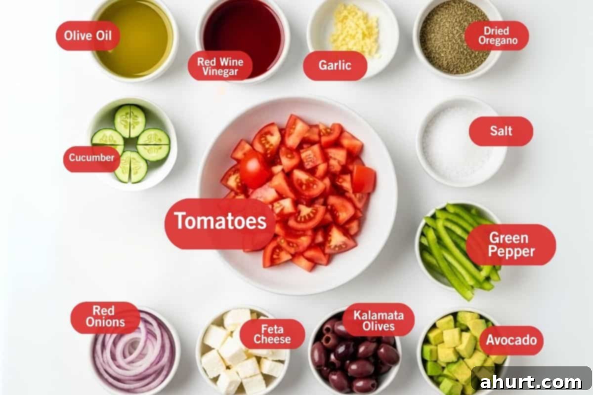 Perfect Greek Salad 3 Flat lay photo of ingredients for Avocado Greek Salad, including olive oil, red wine vinegar, garlic, dried oregano, cucumber, tomatoes, salt, green pepper, avocado, Kalamata olives, feta cheese, and red onions.