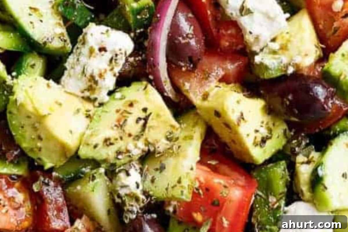 Perfect Greek Salad 6 Step 3: Combine all prepared vegetables, feta cheese, and Kalamata olives in a large bowl. Pour the homemade Greek dressing over and gently toss to coat.