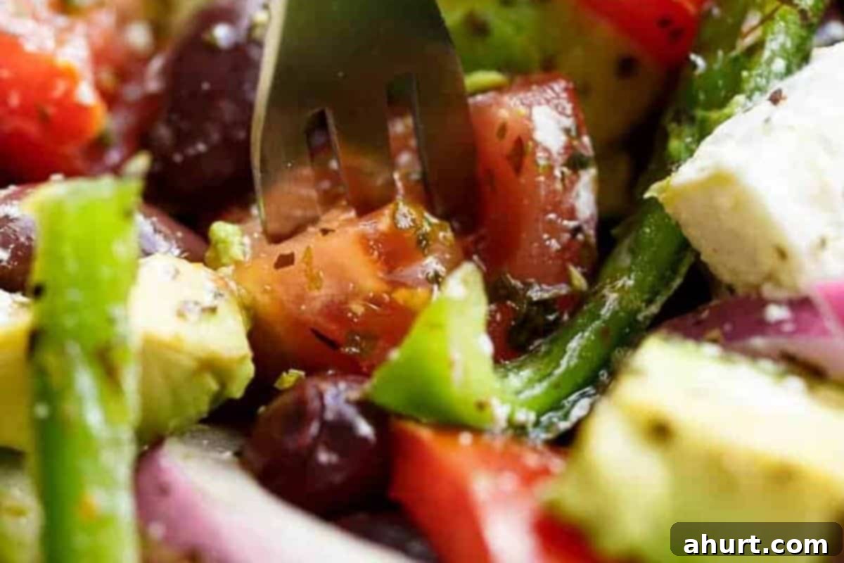 Perfect Greek Salad 7 Step 4: Taste the Avocado Greek Salad, add salt if needed, sprinkle with extra oregano, and serve with various mains like chicken, fish, lamb, or beef.