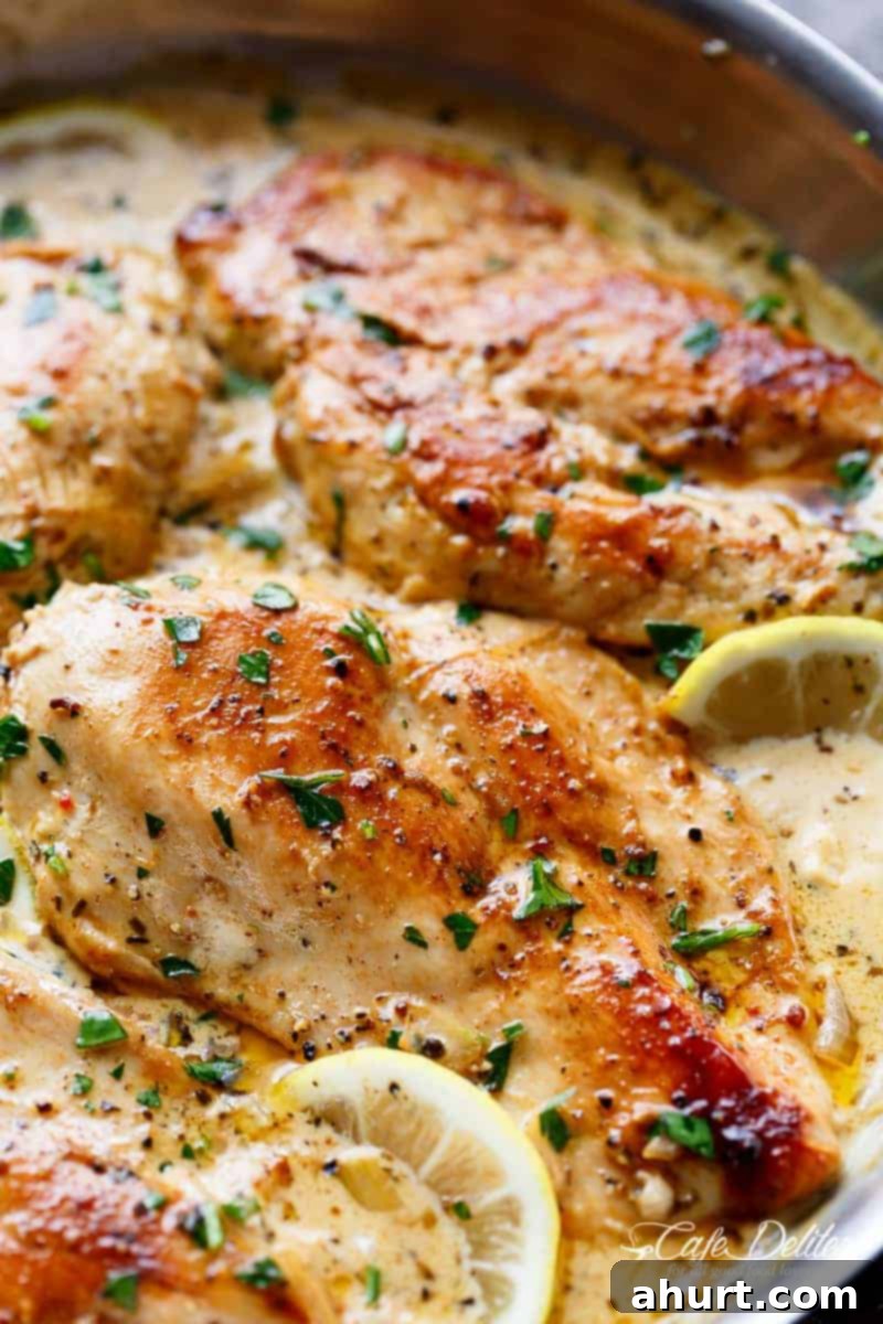 Close-up view of the delicious Lemon Chicken Scallopini with Lemon Garlic Cream Sauce, ready to be served in its cooking pan.