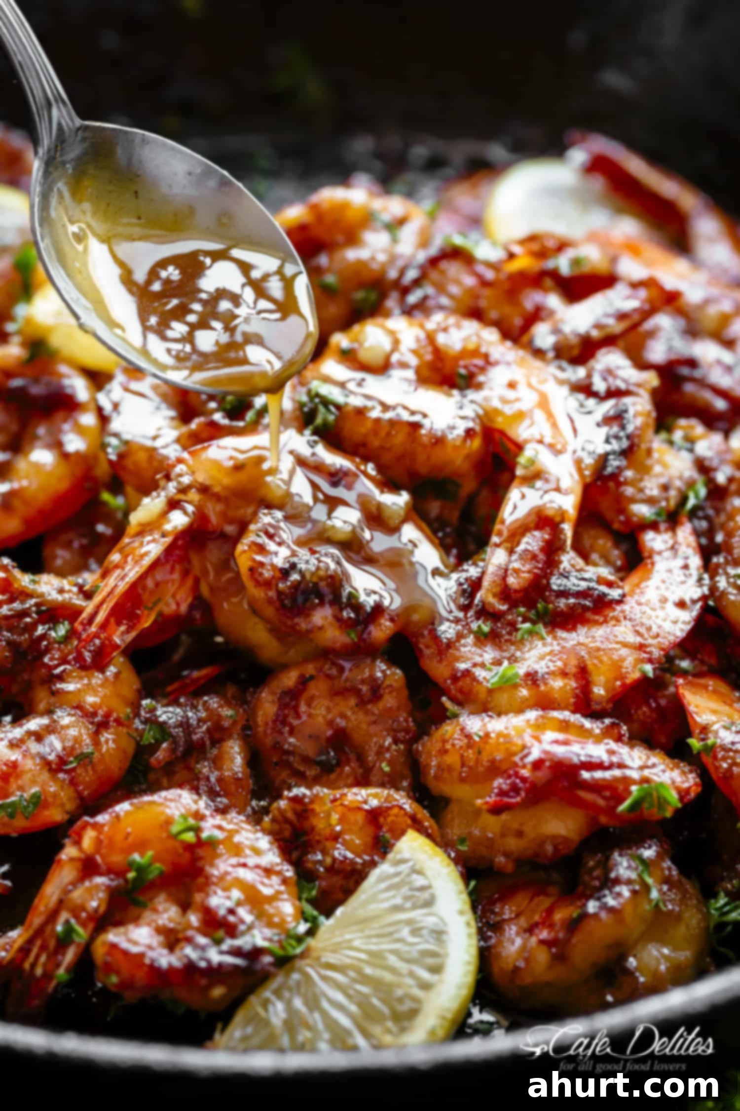 Honey garlic sauce drizzled over freshly cooked browned butter shrimp.