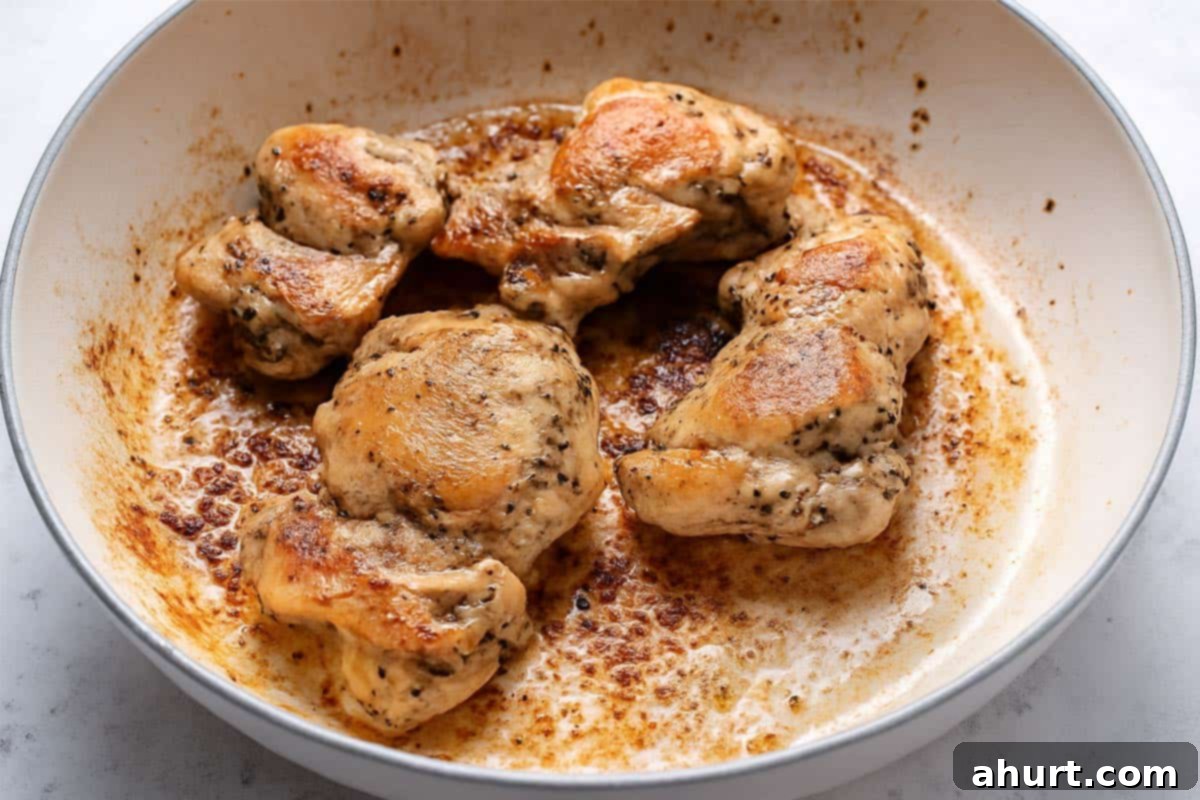 One-Pot Creamy Mushroom Chicken Pasta 4 Seared chicken thighs in a cream pan