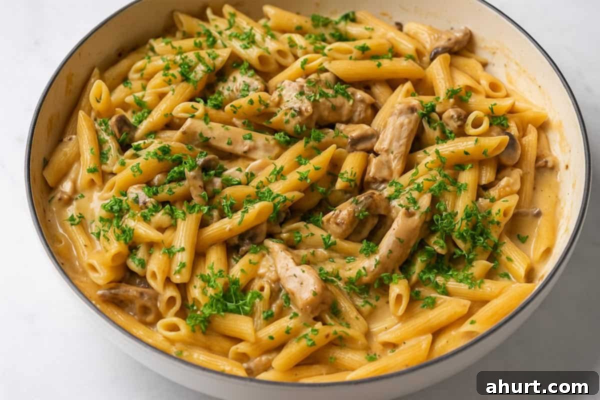 One-Pot Creamy Mushroom Chicken Pasta 8 Creamy mushroom chicken pasta with parsley