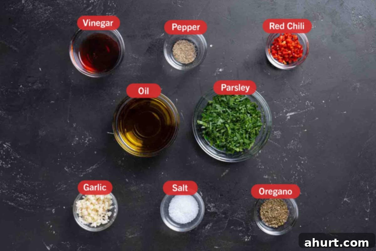 The Authentic Chimichurri of Uruguay and Argentina 3 All the ingredients needed for the preparation of the chimichurri, specifically: vinegar, pepper, red chili, oil, parsley, garlic, salt, and oregano.