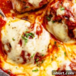 Irresistible Cheesy Meatballs 12 Top view image of Delicious Meatballs are soft, juicy and tender in a homemade tomato sauce!